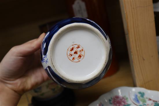 Two Chinese famille rose dishes, a figure of a boy, a porcelain brush pot and a bamboo brush pot tallest 28cm